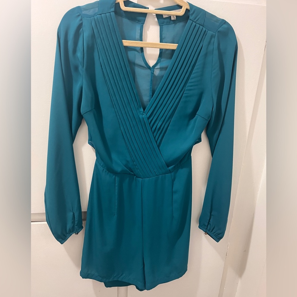 the clothing company Teal Pleated V-Neck Jumpsuit